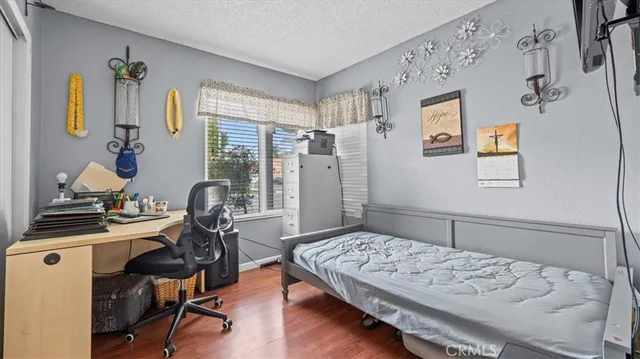 a bedroom with a bed and furniture