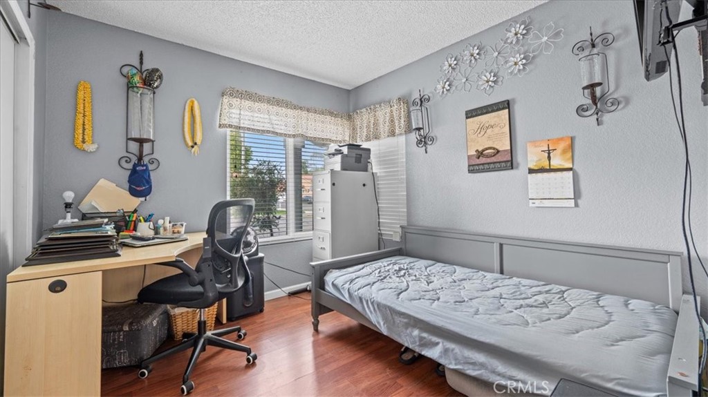 12846 Mayflower Court Riverside, CA 92503 - Photo 18 of 32 a bedroom with a bed and furniture