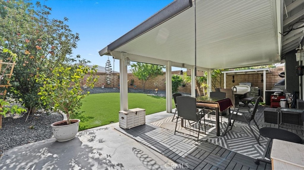 12846 Mayflower Court Riverside, CA 92503 - Photo 20 of 32 a view of a patio with table and chairs and potted plants