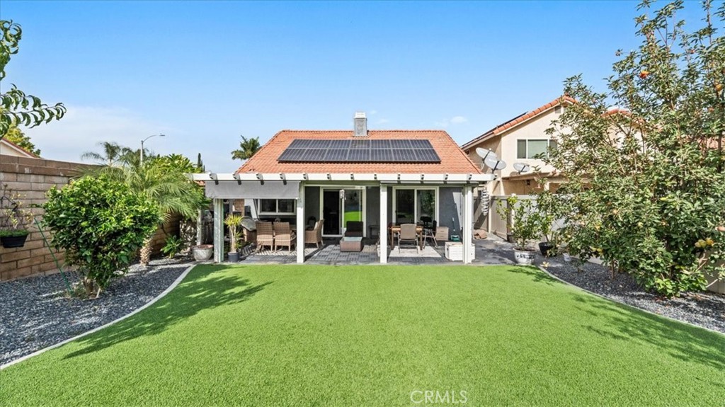 12846 Mayflower Court Riverside, CA 92503 - Photo 22 of 32 a front view of a house with a yard table and chairs