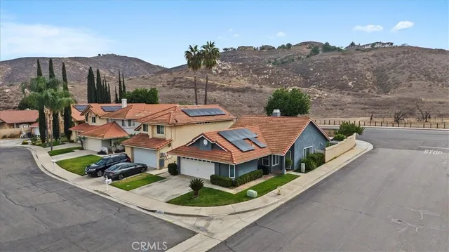 an aerial view of residential houses and outdoor space