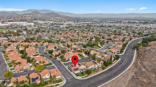 an aerial view of a residential houses with street view