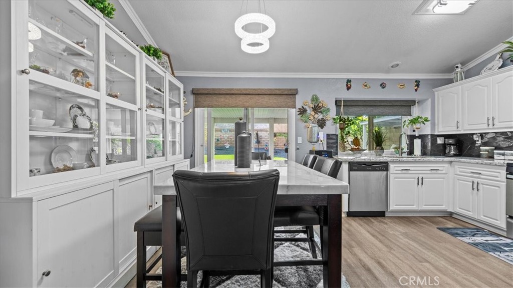 12846 Mayflower Court Riverside, CA 92503 - Photo 7 of 32 a kitchen with stainless steel appliances granite countertop a white cabinets and a stove