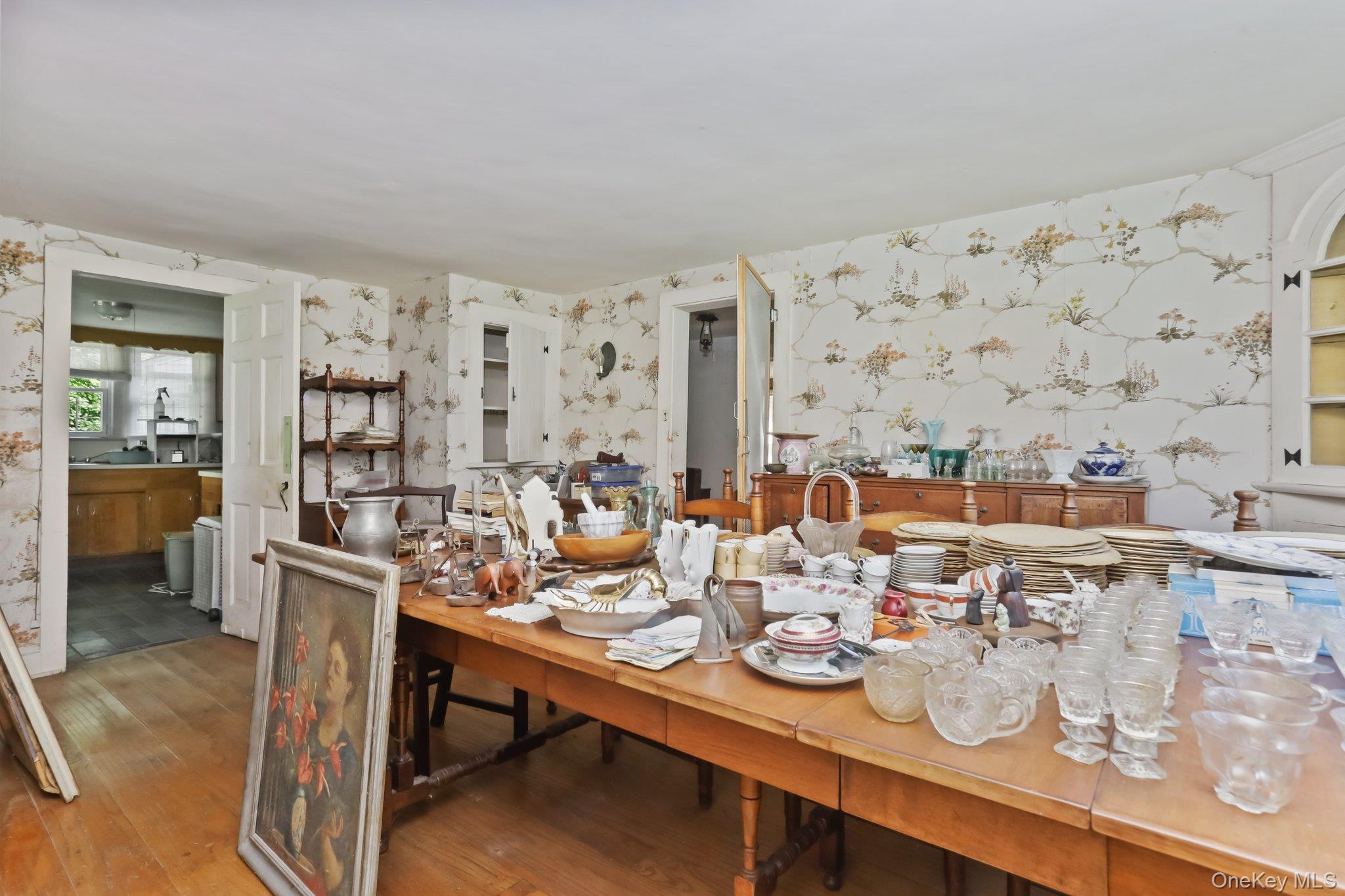 3868 Indian Hill Road Shrub Oak, NY 10588 - Photo 14 of 33 a dining room with wooden floor and large windows