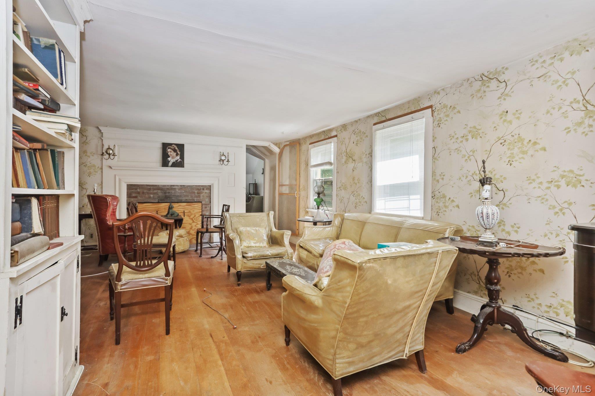 3868 Indian Hill Road Shrub Oak, NY 10588 - Photo 17 of 33 a living room with furniture and a book shelf