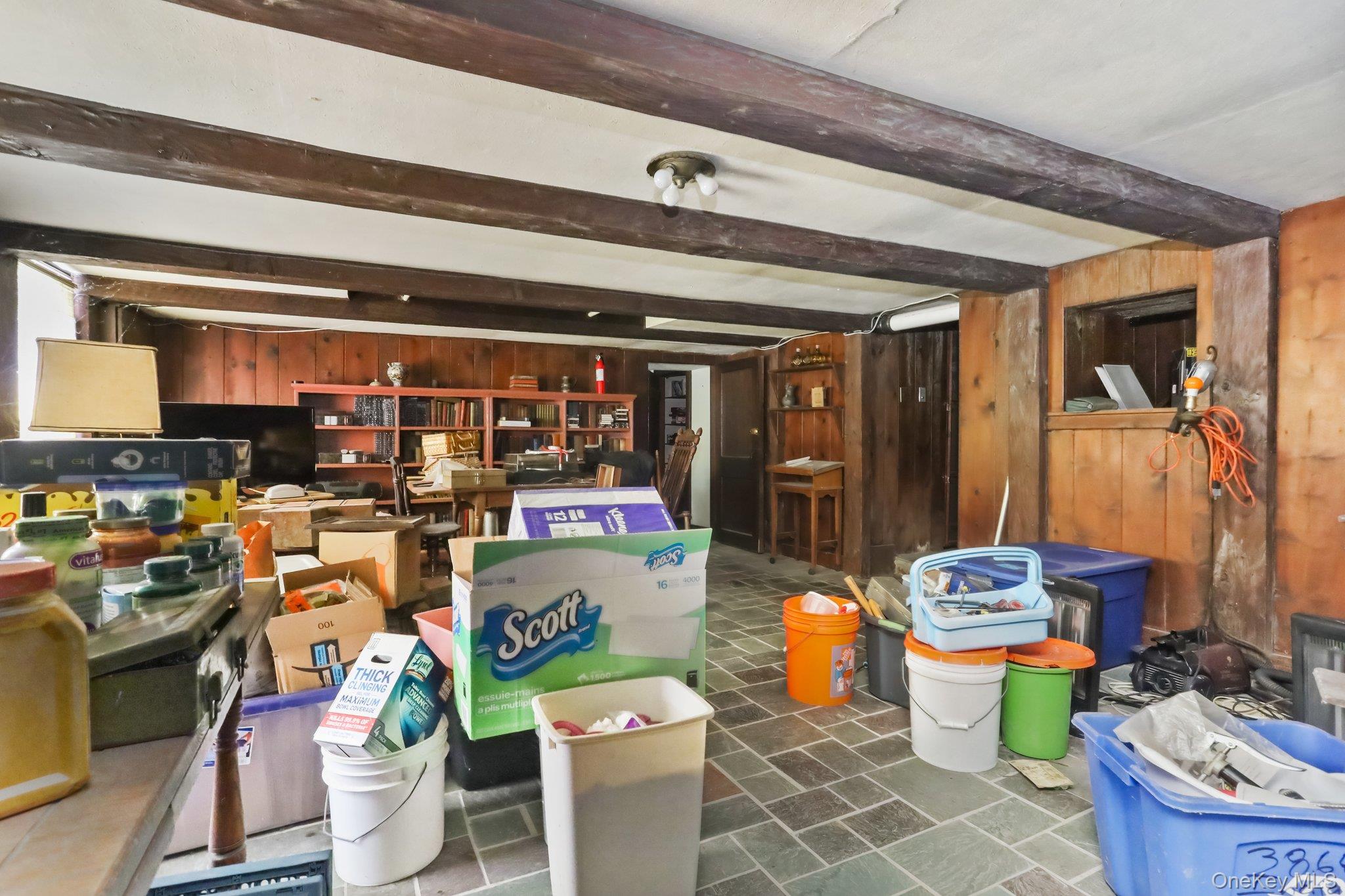 3868 Indian Hill Road Shrub Oak, NY 10588 - Photo 29 of 33 a room with stainless steel appliances lots of different colored cloths