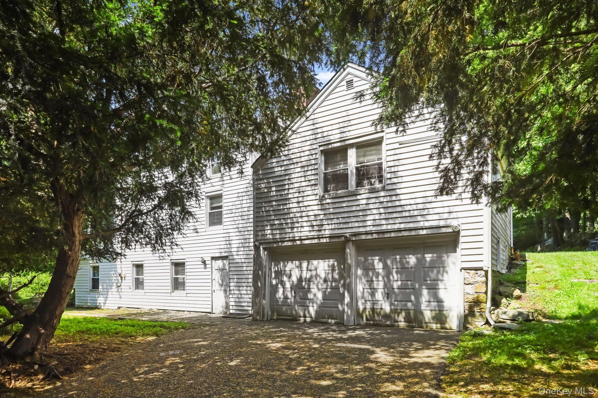 3868 Indian Hill Road Shrub Oak, NY 10588 - Photo 32 of 33 a front view of a house with a garden