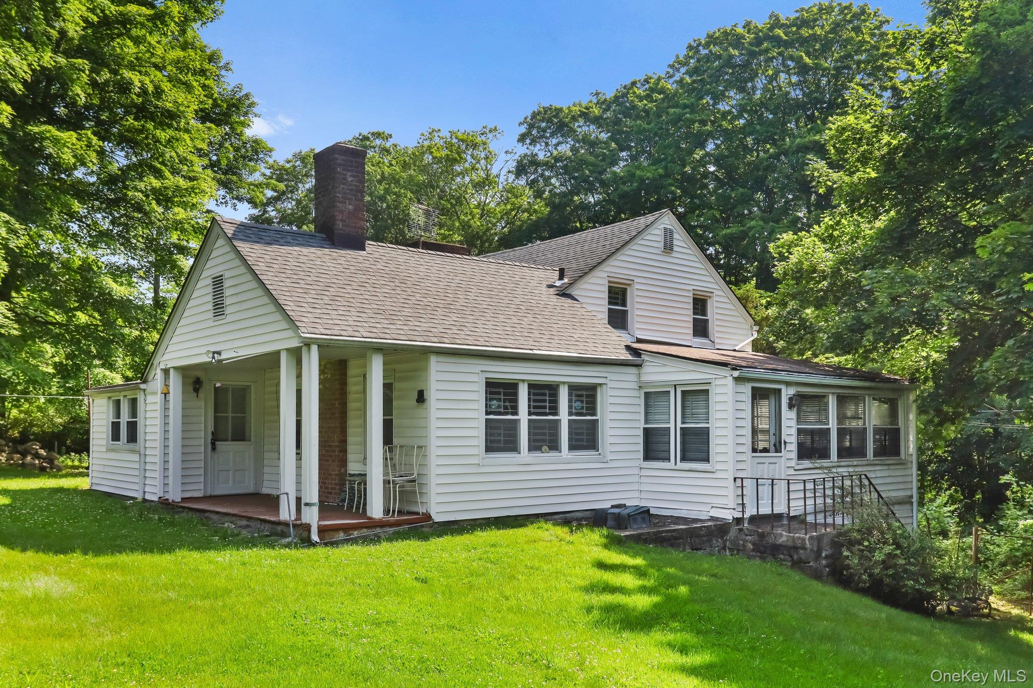 3868 Indian Hill Road Shrub Oak, NY 10588 - Photo 4 of 33 a front view of a house with a yard