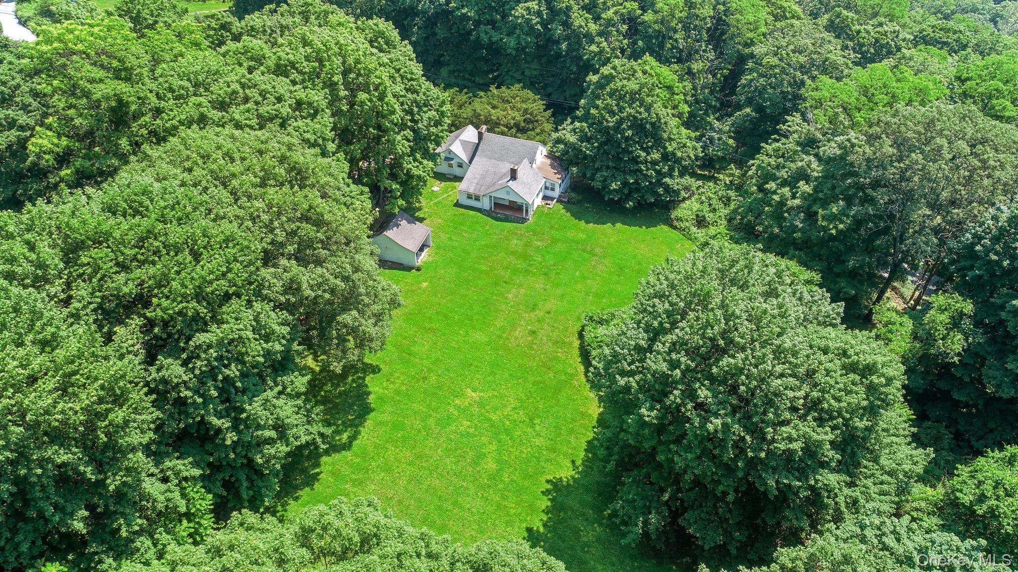 3868 Indian Hill Road Shrub Oak, NY 10588 - Photo 7 of 33 an aerial view of a house with a yard