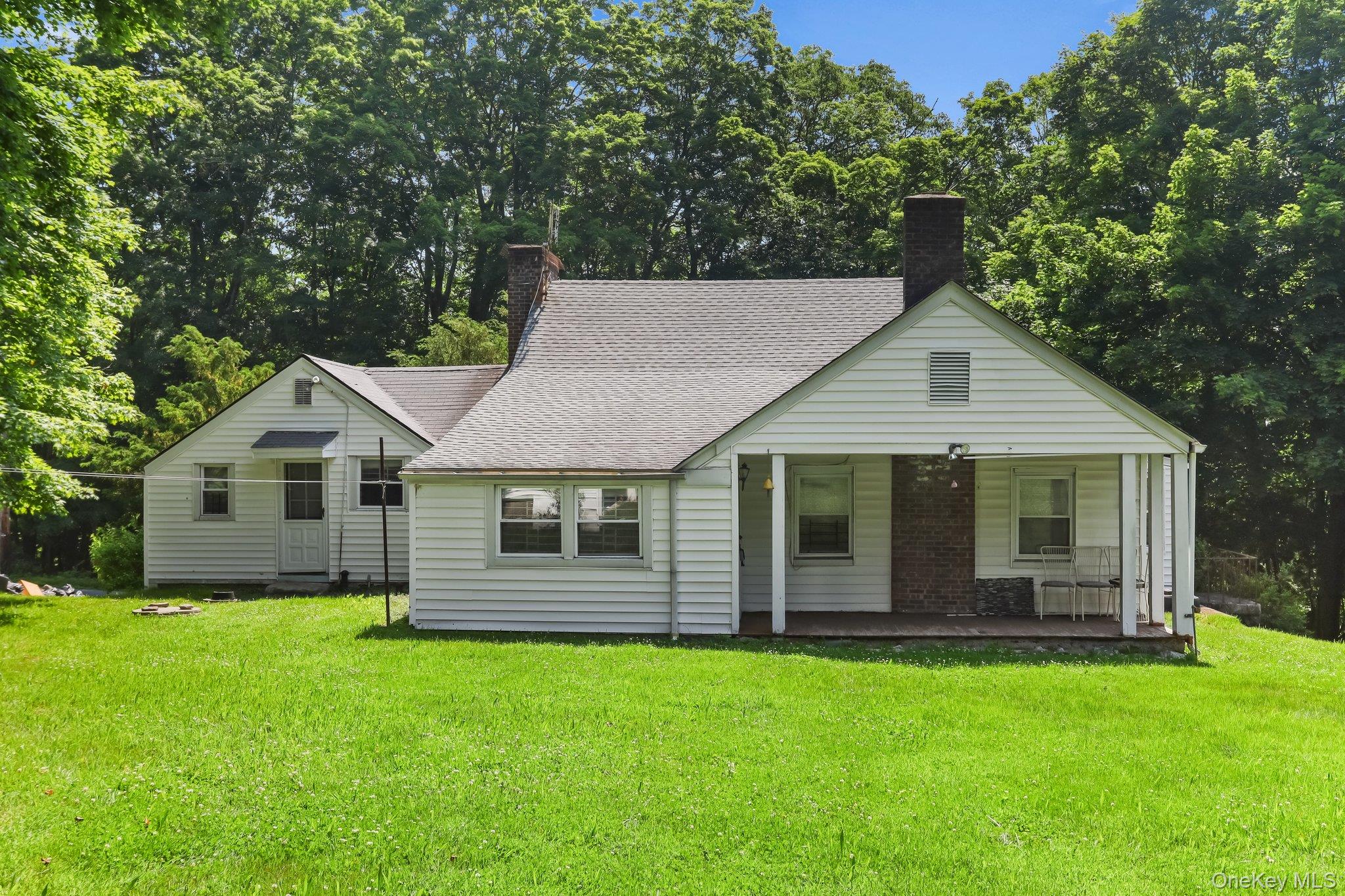 3868 Indian Hill Road Shrub Oak, NY 10588 - Photo 8 of 33 a front view of house with yard and green space