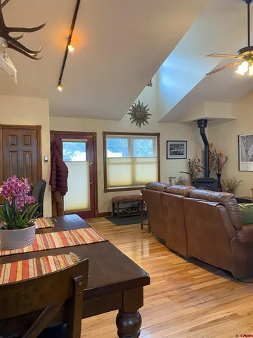 a living room with furniture a window and a chandelier