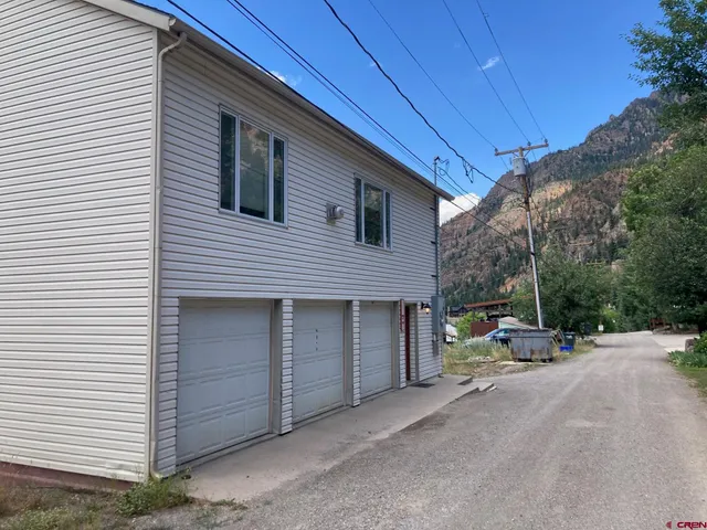 a view of car parked in front of house