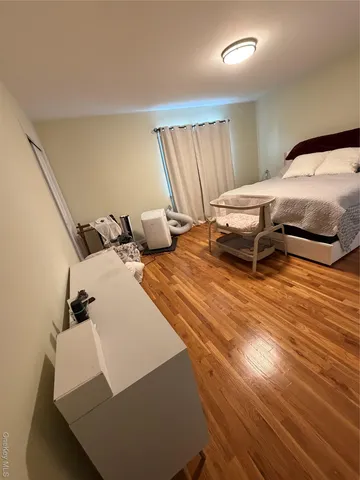 a bedroom with bed and window