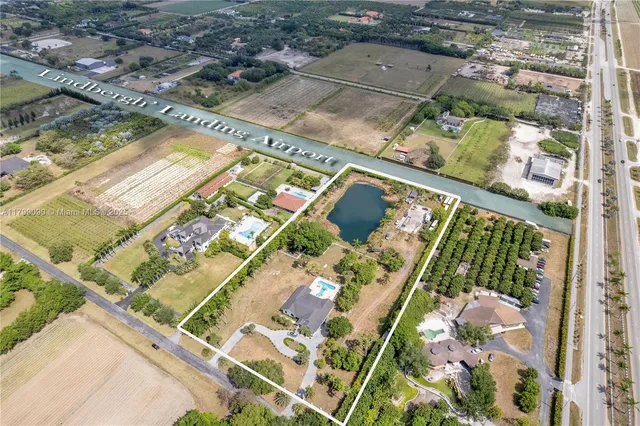 a front view of a house with a garden and plants