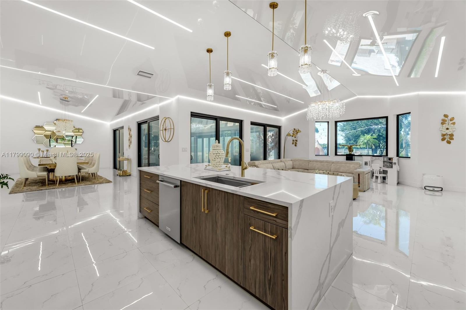 17795 Southwest 158th Street Miami, FL 33187 - Photo 12 of 45 a large white kitchen with a large window