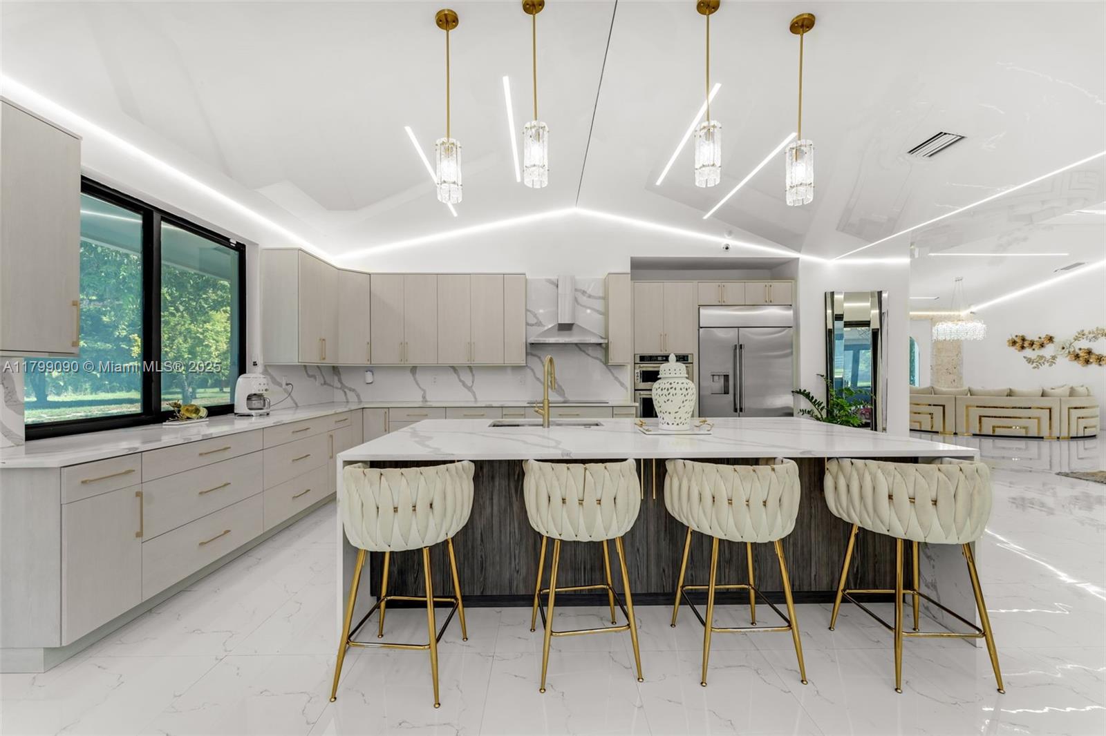 17795 Southwest 158th Street Miami, FL 33187 - Photo 13 of 45 a kitchen with a table and chairs in it