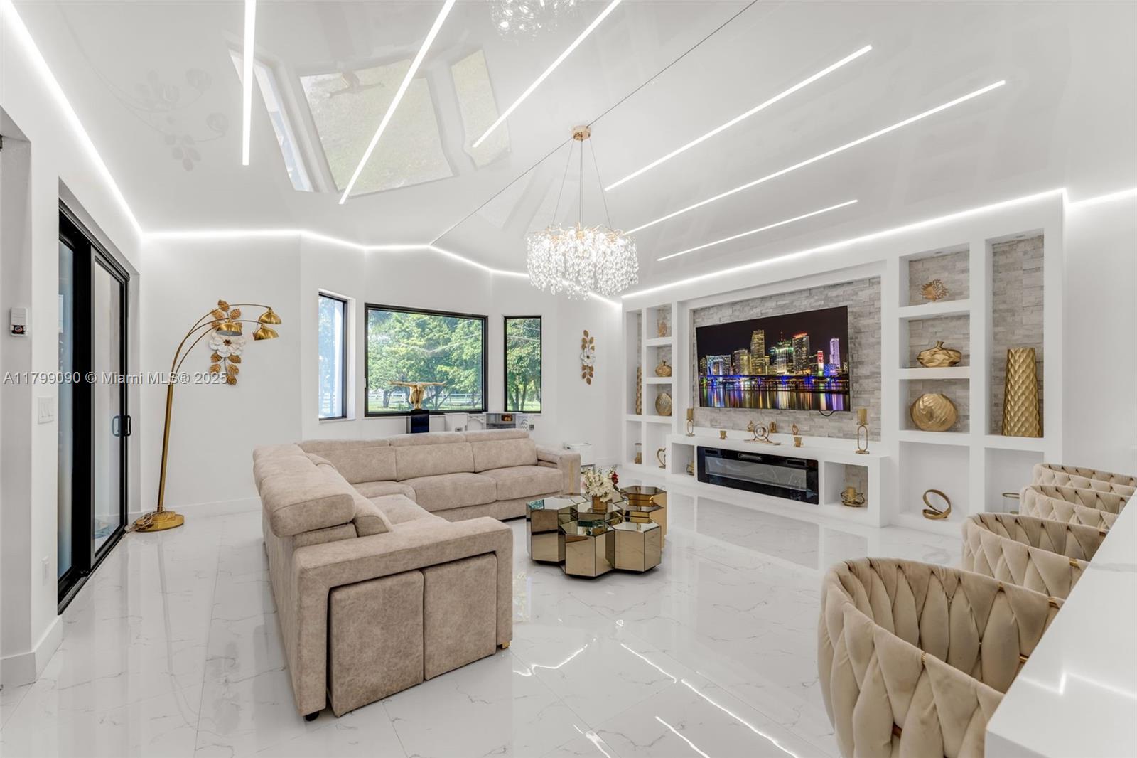 17795 Southwest 158th Street Miami, FL 33187 - Photo 14 of 45 a living room with furniture and a flat screen tv