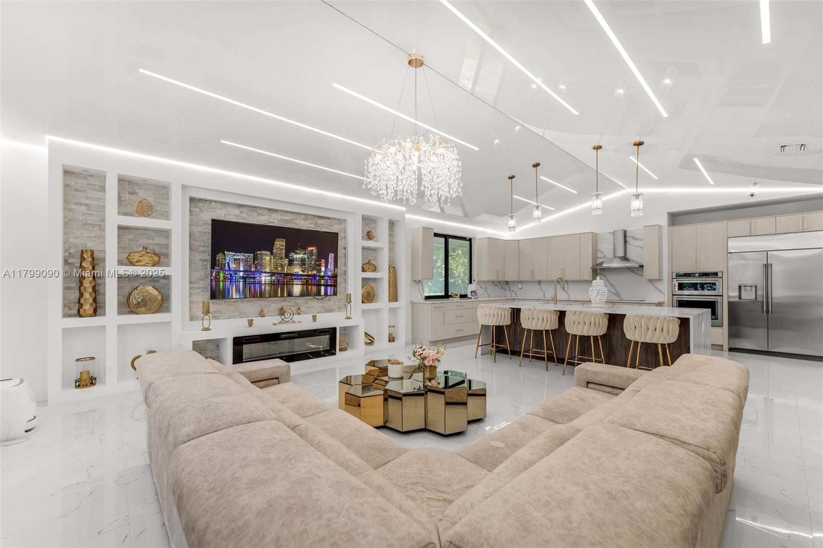 17795 Southwest 158th Street Miami, FL 33187 - Photo 15 of 45 a living room with furniture kitchen view and a chandelier