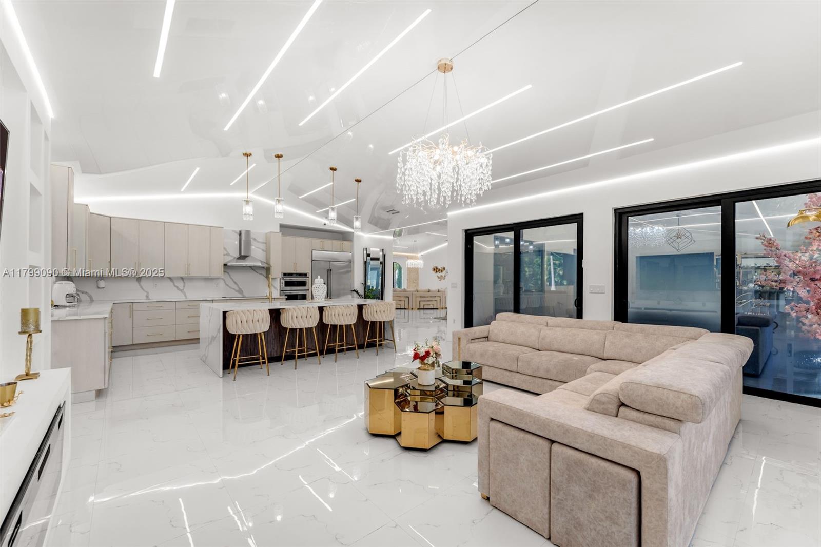 17795 Southwest 158th Street Miami, FL 33187 - Photo 16 of 45 a living room with furniture and kitchen view