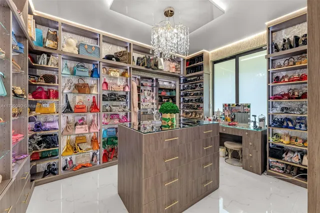 a bedroom with furniture and a large window