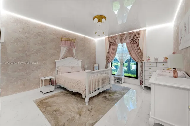 a bed room with a bed and a chair