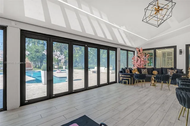 a view of an entryway with a floor to ceiling window