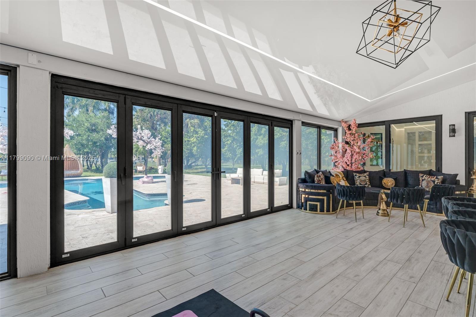 17795 Southwest 158th Street Miami, FL 33187 - Photo 35 of 45 a view of dining room with furniture window and wooden floor