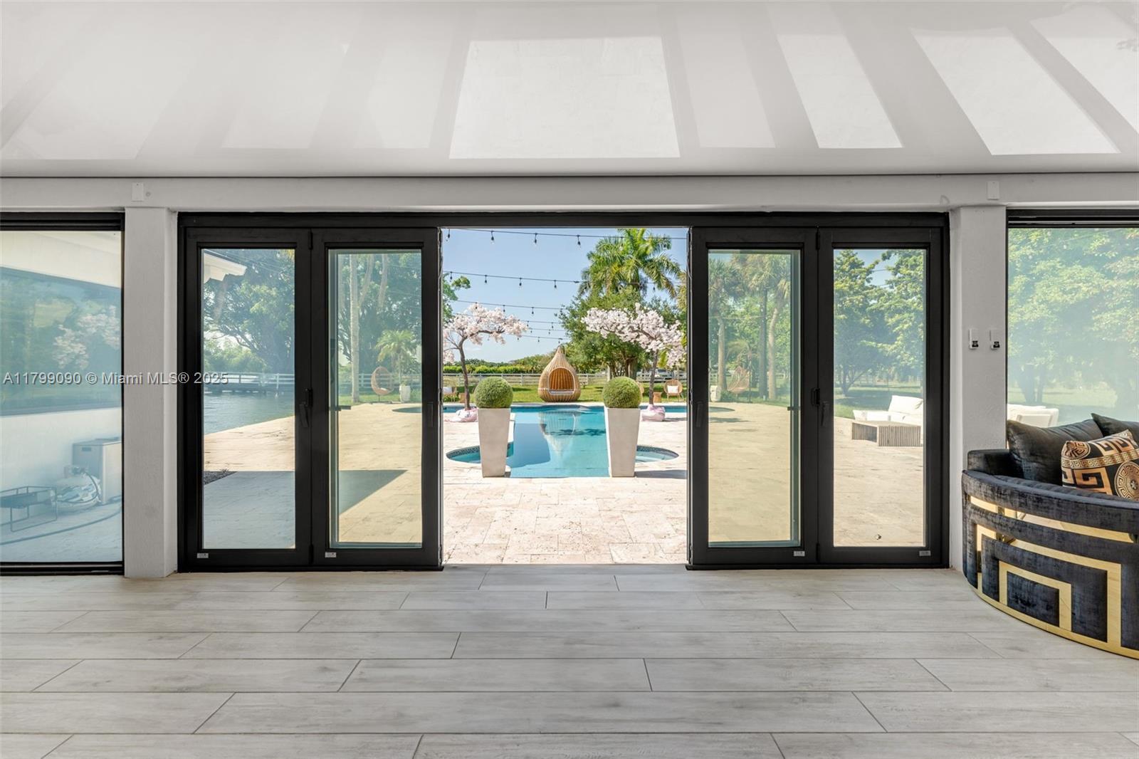 17795 Southwest 158th Street Miami, FL 33187 - Photo 36 of 45 a view of an entryway with a floor to ceiling window