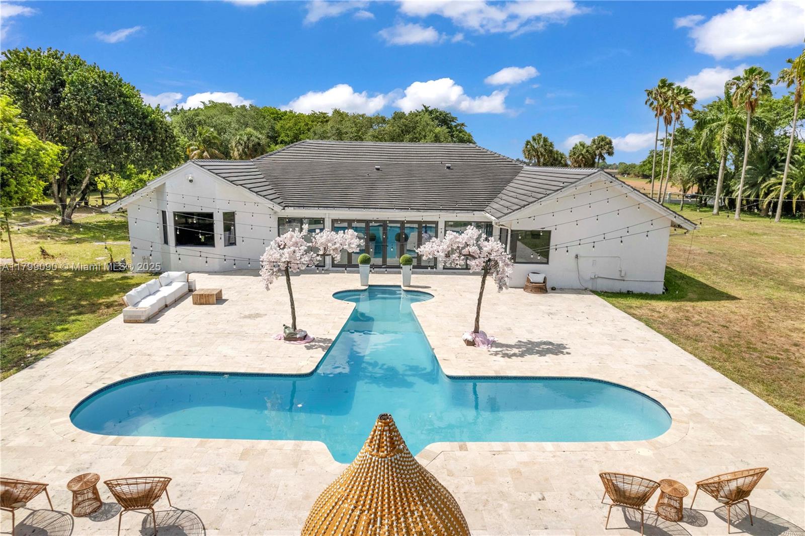 17795 Southwest 158th Street Miami, FL 33187 - Photo 4 of 45 a view of a house with a patio