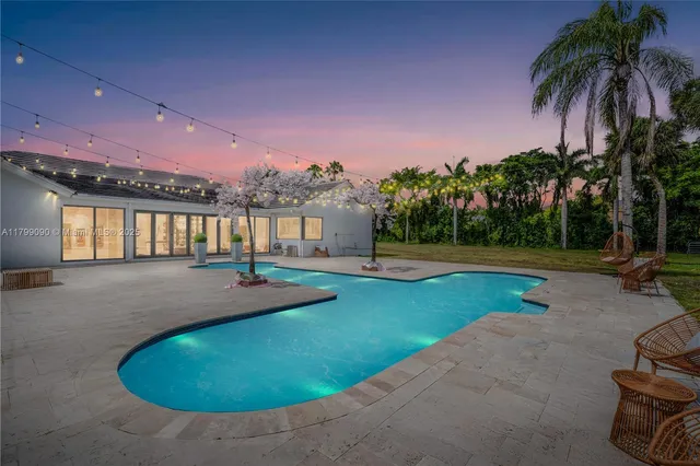 a view of a city with lots of residential buildings and ocean view