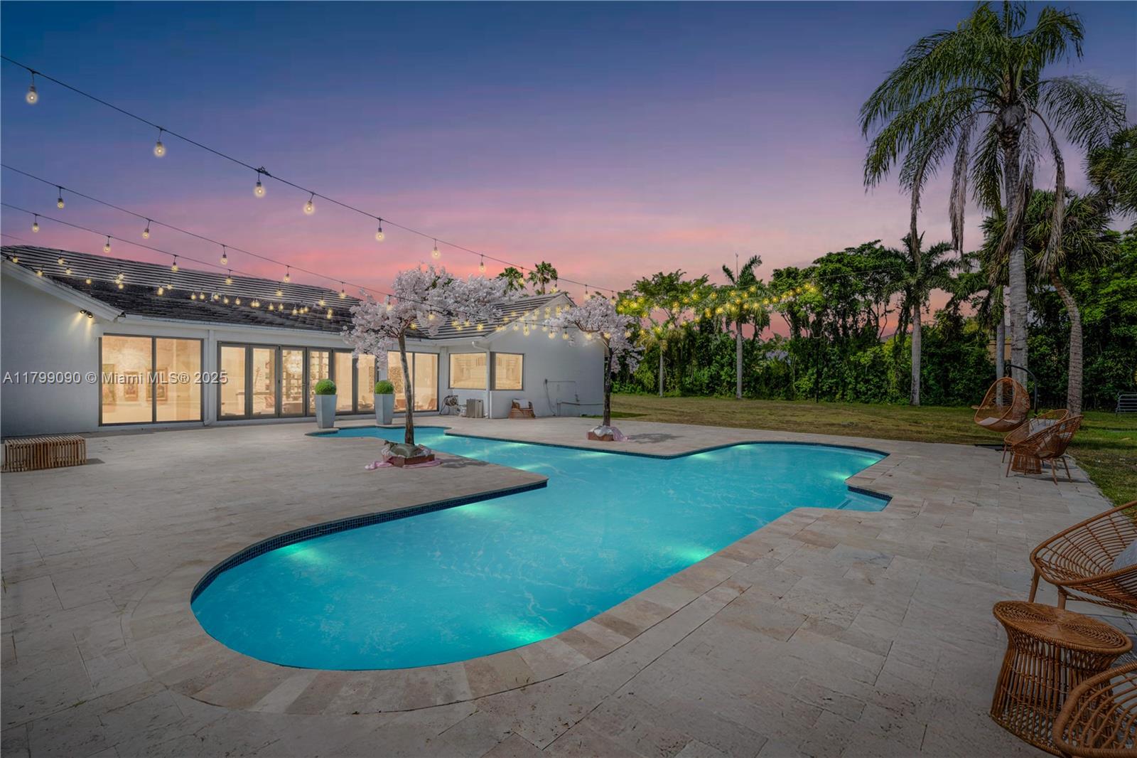 17795 Southwest 158th Street Miami, FL 33187 - Photo 42 of 45 a view of a swimming pool with an outdoor space and seating area