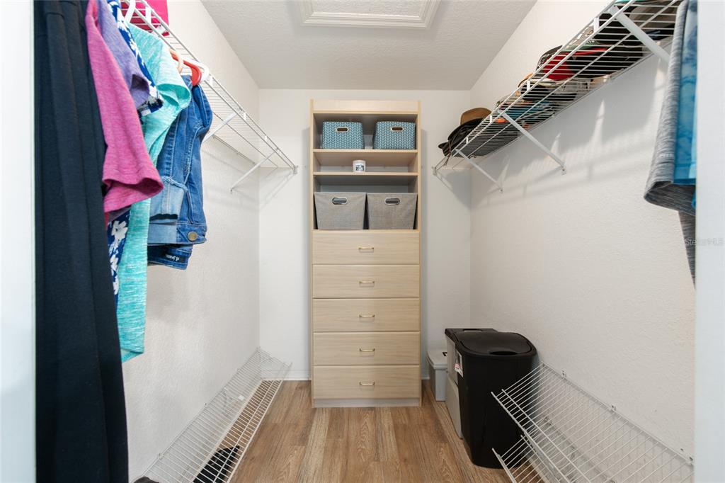 18825 Southwest 93rd Loop Dunnellon, FL 34432 - Photo 45 of 85 a view of walk in closet with clothes and shoes