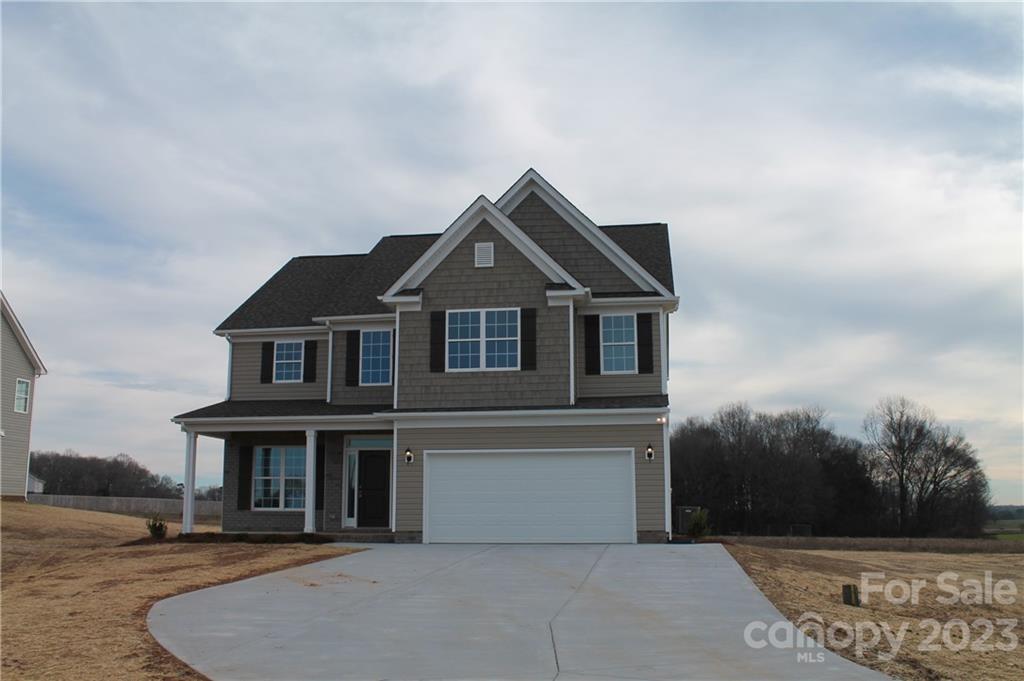 3224 Austin Chaney Road Monroe, NC 28110 - Photo 1 of 23 a front view of a house with a yard