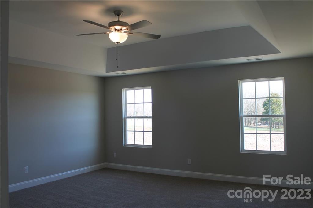 3224 Austin Chaney Road Monroe, NC 28110 - Photo 11 of 23 wooden floor in an empty room with a window