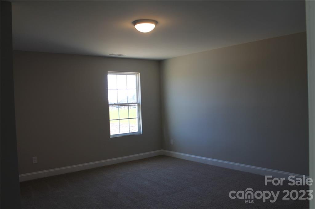 3224 Austin Chaney Road Monroe, NC 28110 - Photo 18 of 23 an empty room with a window
