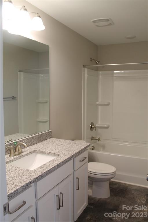 3224 Austin Chaney Road Monroe, NC 28110 - Photo 20 of 23 a bathroom with a granite countertop sink a toilet and shower
