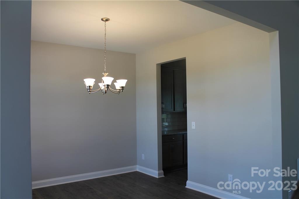 3224 Austin Chaney Road Monroe, NC 28110 - Photo 2 of 23 a view of a hallway with chandelier