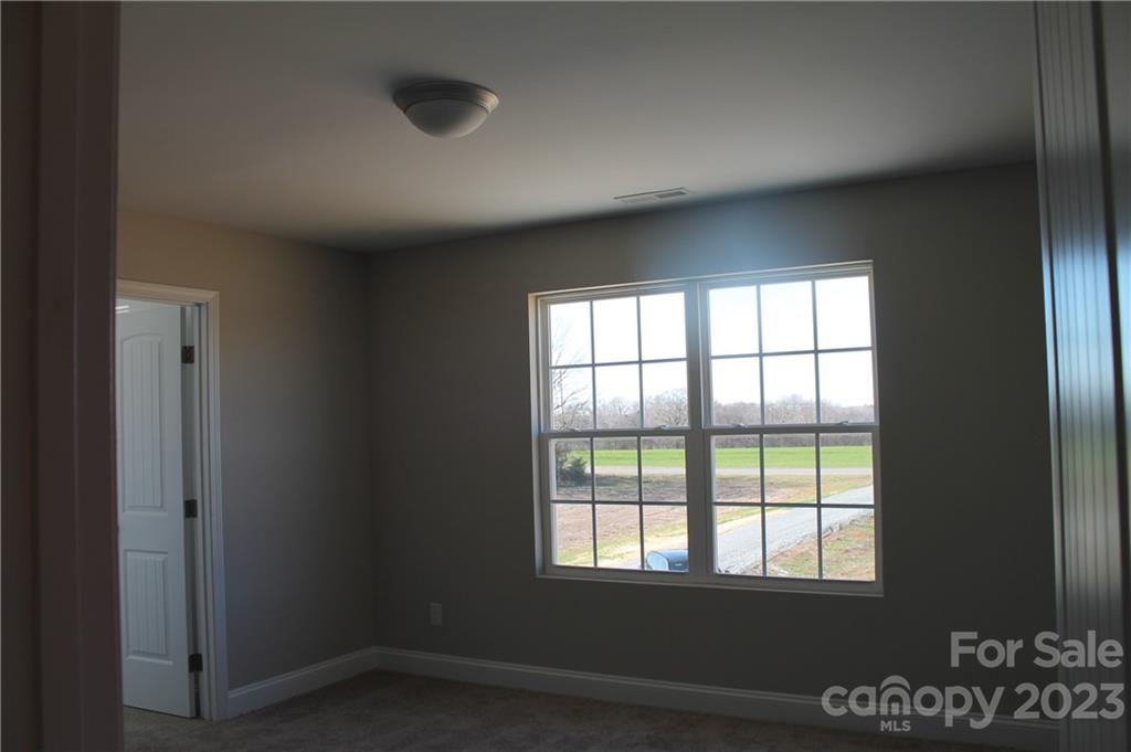 3224 Austin Chaney Road Monroe, NC 28110 - Photo 22 of 23 a view of an empty room with a window