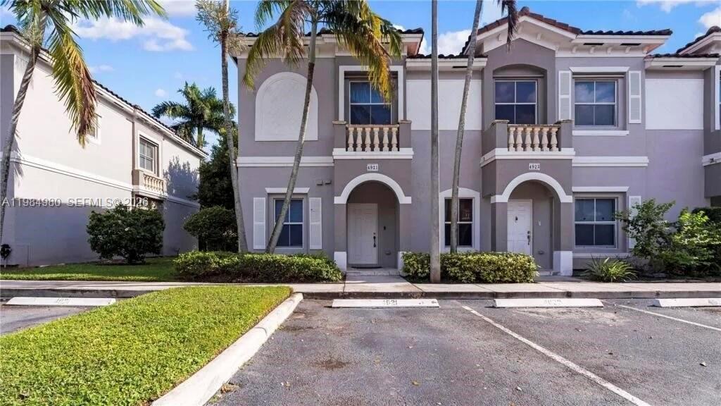 4921 Southwest 140th Terrace, Unit 1 Miramar, FL 33027 - Photo 1 of 16 front view of a brick house with a yard