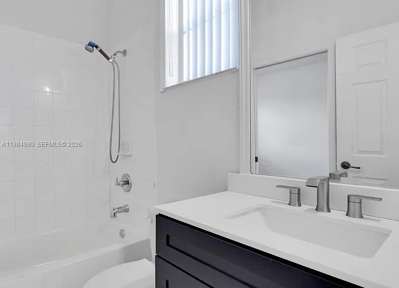 4921 Southwest 140th Terrace, Unit 1 Miramar, FL 33027 - Photo 16 of 16 a bathroom with a sink a toilet and shower