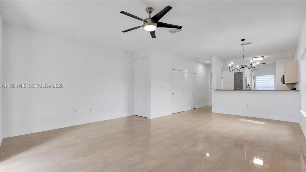 4921 Southwest 140th Terrace, Unit 1 Miramar, FL 33027 - Photo 2 of 16 an empty room with a ceiling fan and a window