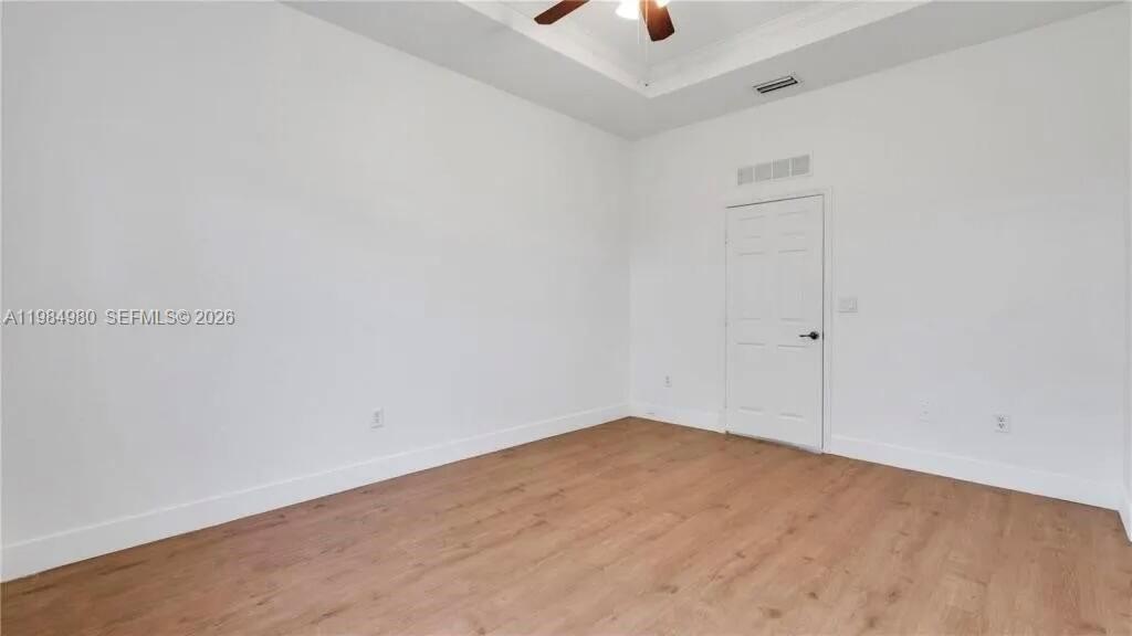 4921 Southwest 140th Terrace, Unit 1 Miramar, FL 33027 - Photo 10 of 16 an empty room with a ceiling fan and carpet