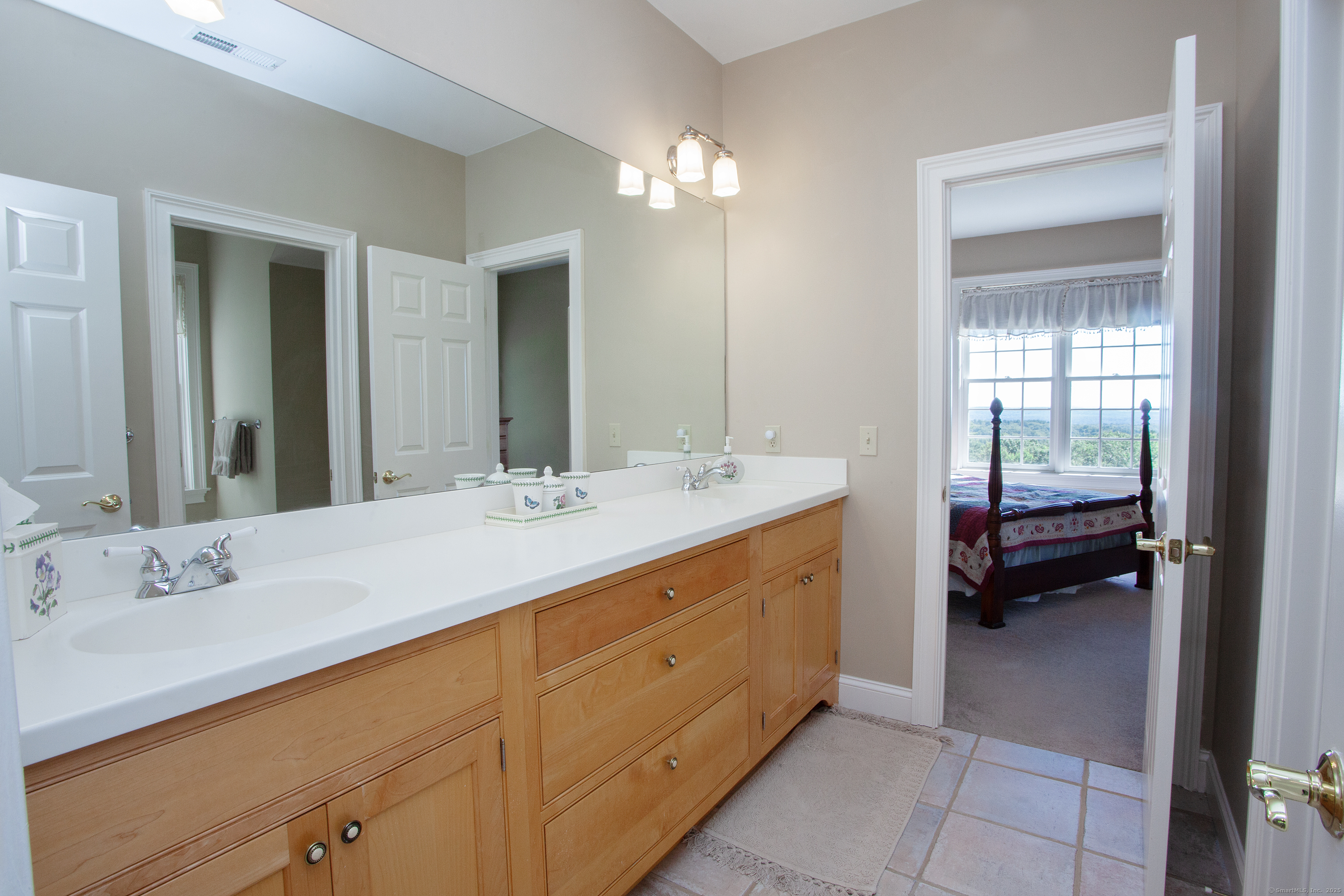 15 Old Orchard Road Granby, CT 06090 - Photo 28 of 32 Jack & Jill bathroom between bedrooms 4 & 5 features double vanity and tub shower.