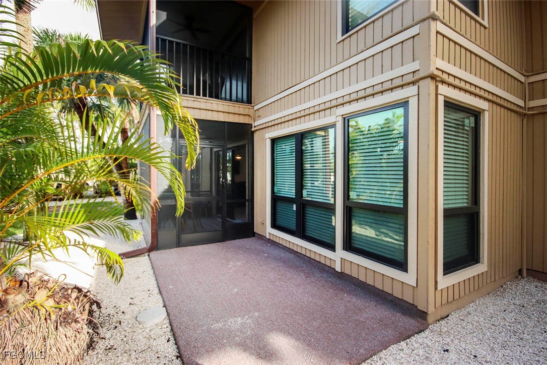 5117 Sea Bell Road, Unit A102 Sanibel, FL 33957 - Photo 19 of 21 a view of a house with a balcony