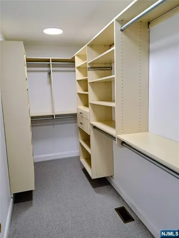 a view of an empty walk in closet