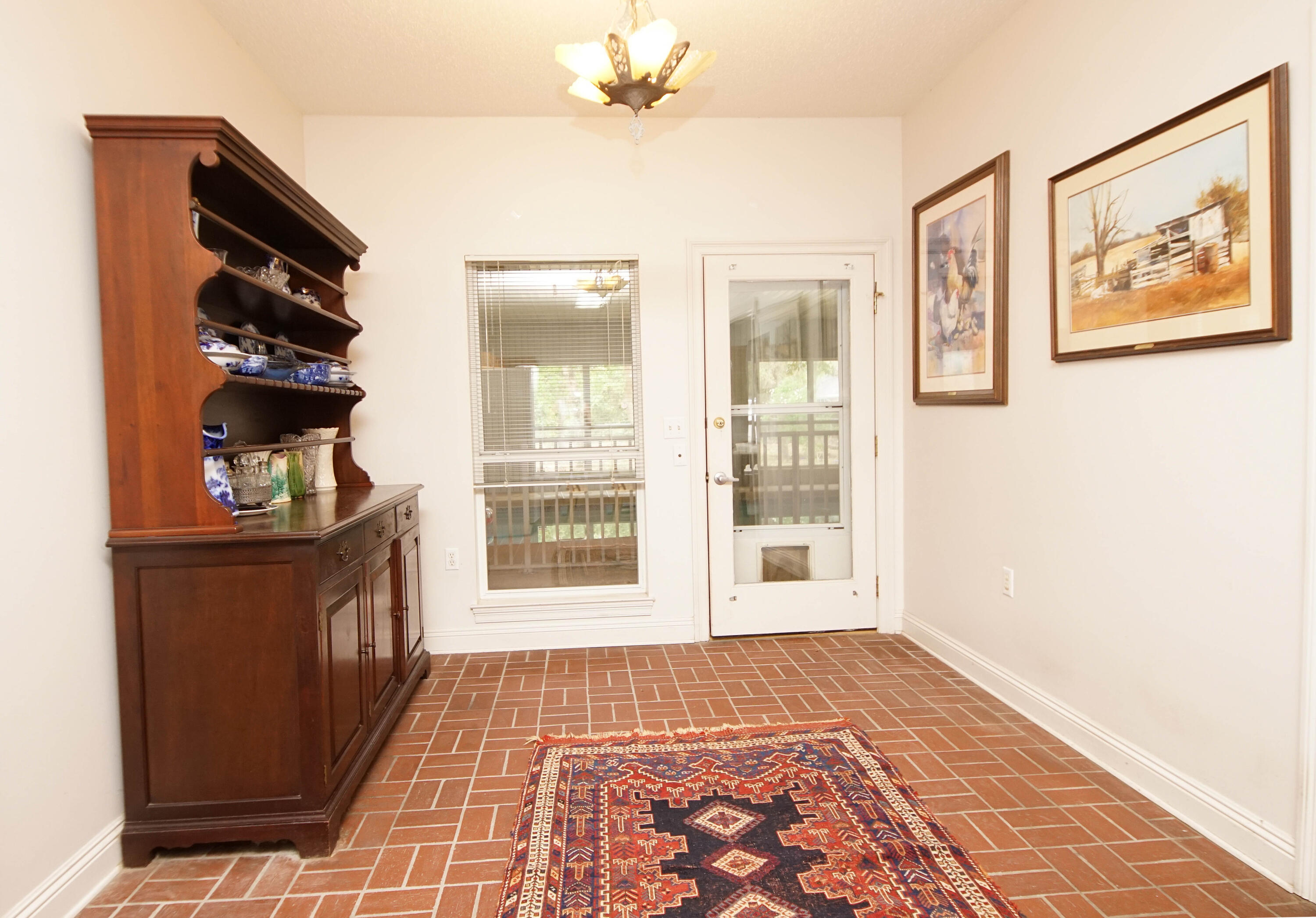 600 Northwest Mooney Road Fort Walton Beach, FL 32547 - Photo 19 of 35 a view of an empty room with a window and kitchen view