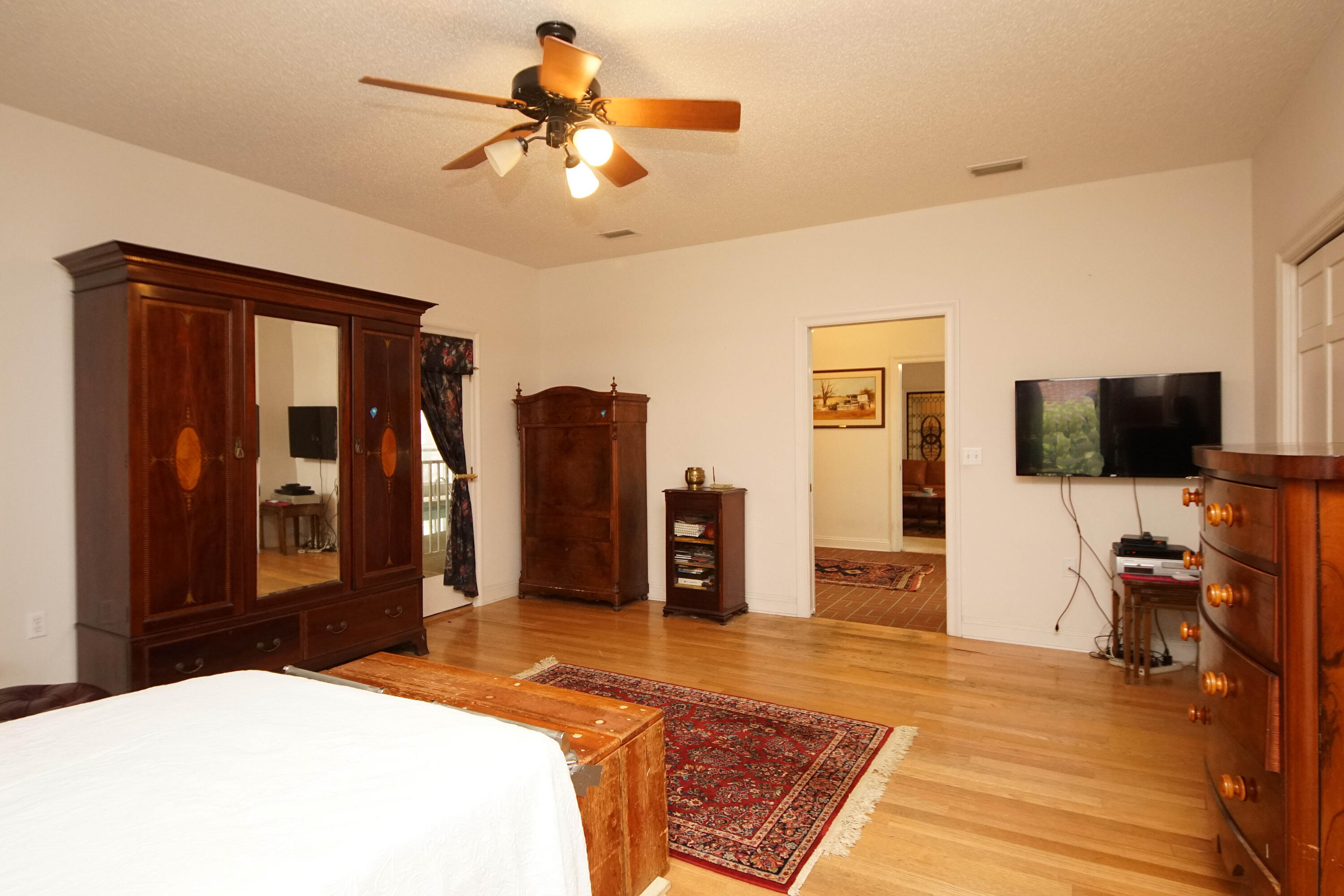 600 Northwest Mooney Road Fort Walton Beach, FL 32547 - Photo 21 of 35 a bedroom with a bed and a flat screen tv
