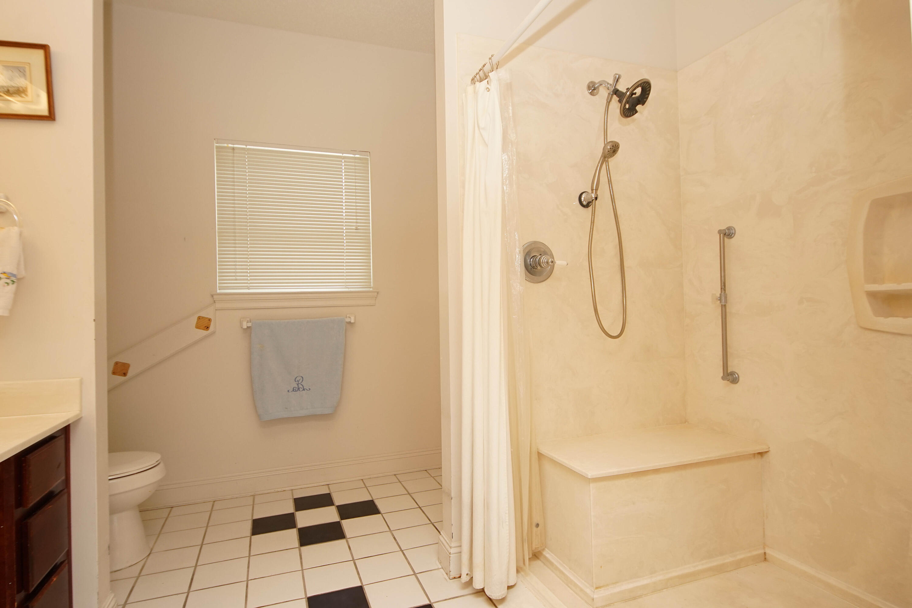 600 Northwest Mooney Road Fort Walton Beach, FL 32547 - Photo 23 of 35 a bathroom with a granite countertop shower a toilet and a sink