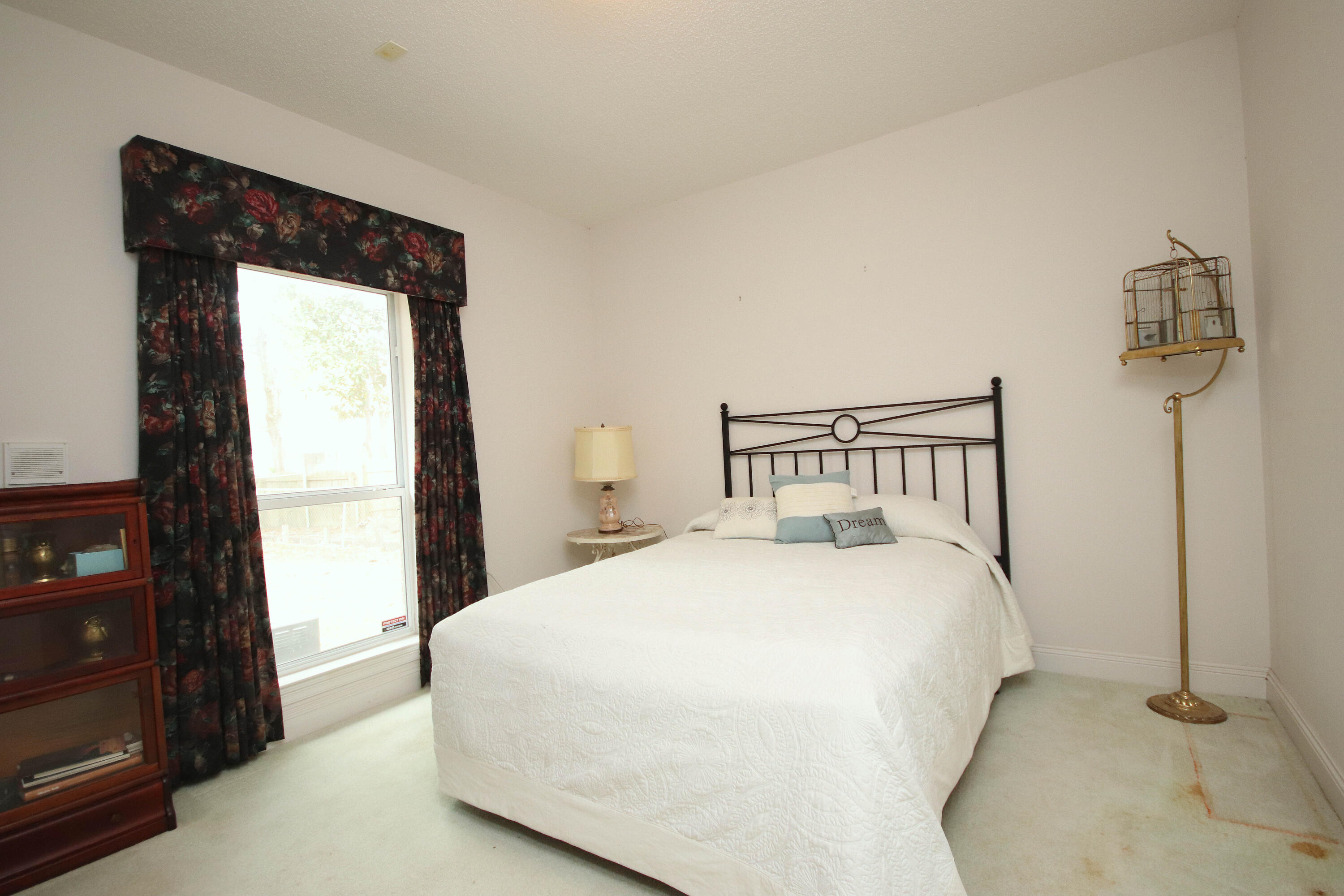 600 Northwest Mooney Road Fort Walton Beach, FL 32547 - Photo 25 of 35 a bedroom with a bed and window