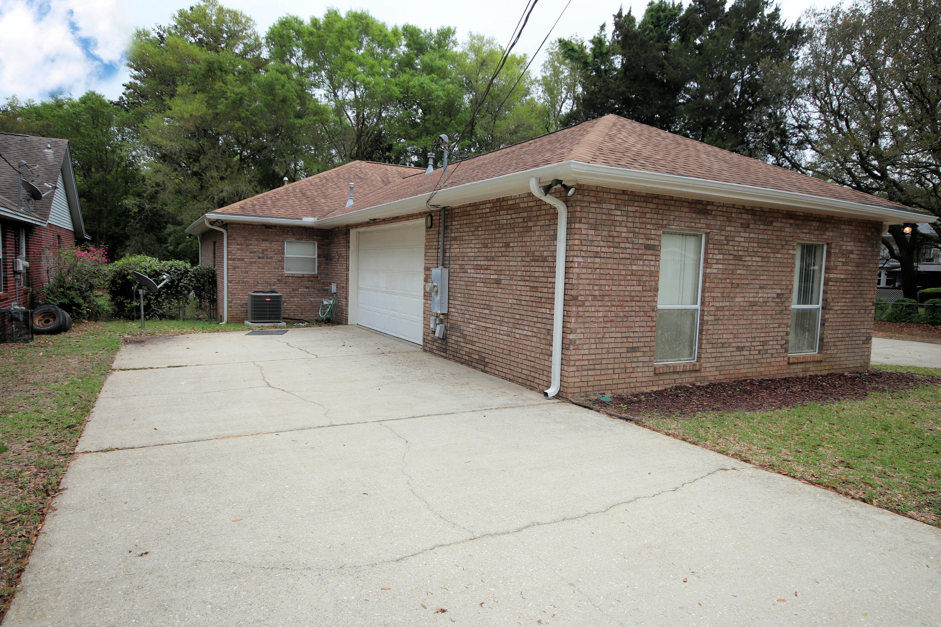 600 Northwest Mooney Road Fort Walton Beach, FL 32547 - Photo 7 of 35 a front view of a house with a garden